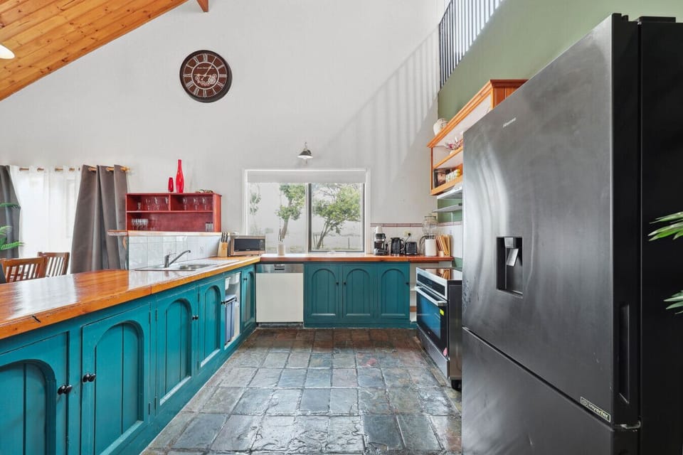 Experience the fresh and organised ambience of the kitchen, ideal for efficient meal prep at the generous counter space, complemented by stainless steel appliances.