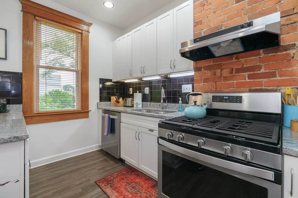 Kitchen: Our bright, remodeled kitchen with every possible thing you could ever need to cook or bake.