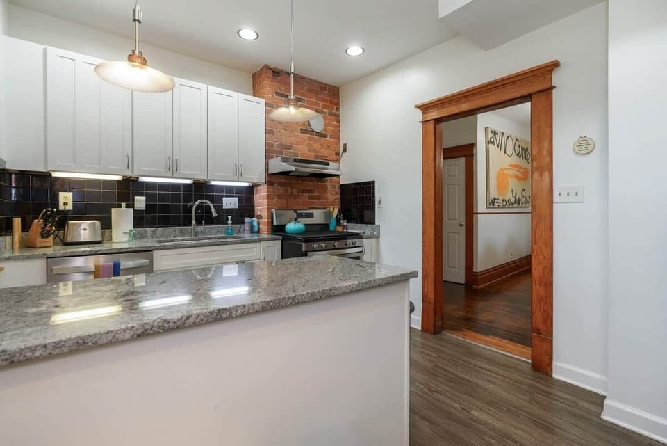 Kitchen: Our bright, remodeled kitchen with every possible thing you could ever need to cook or bake.