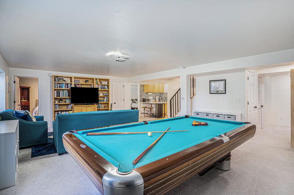 Movie, game, secondary living room and pool table easily accessible for a good time.