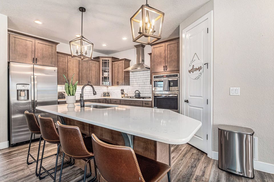 Gather at the heart of the home, where a spacious island invites shared meals, morning coffee, and easy conversation. Fully equipped and thoughtfully stocked, this kitchen makes cooking for your group feel simple, seamless, and enjoyable.

