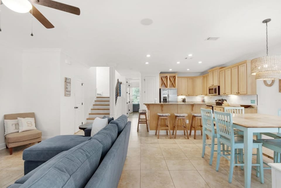The open floor plan keeps the living room, dining, and kitchen all within easy reach of each other.