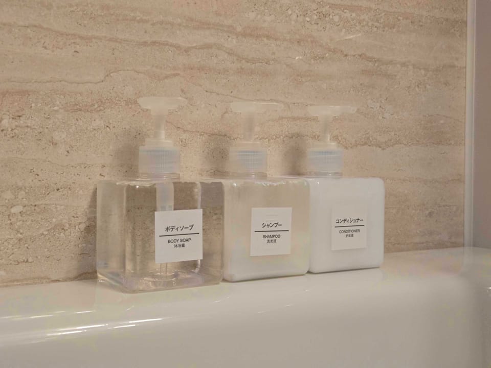 Separate tub and shower, towels, shampoo, toilet paper