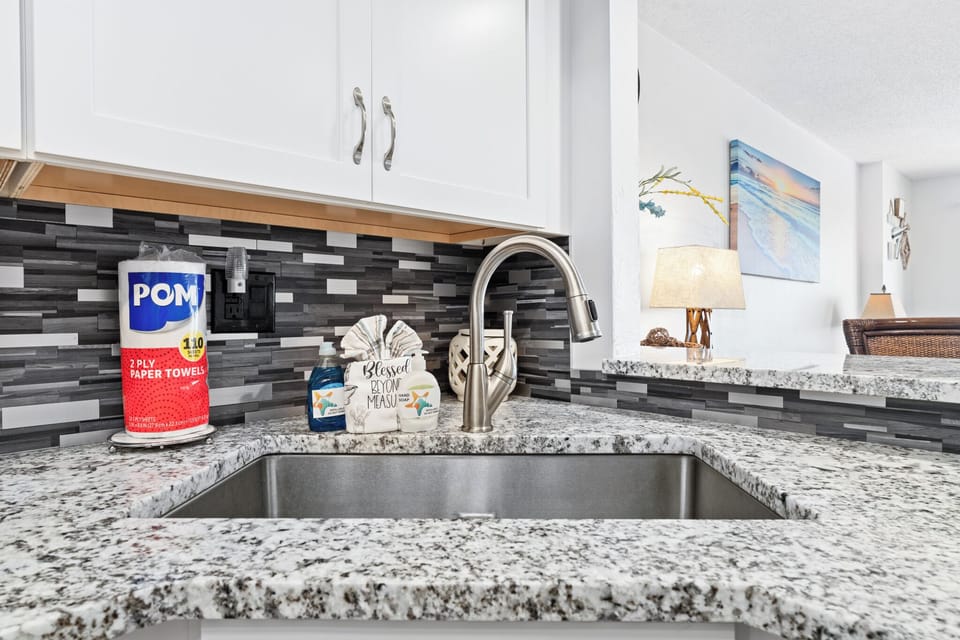 Kitchen is updated with granite countertops. 