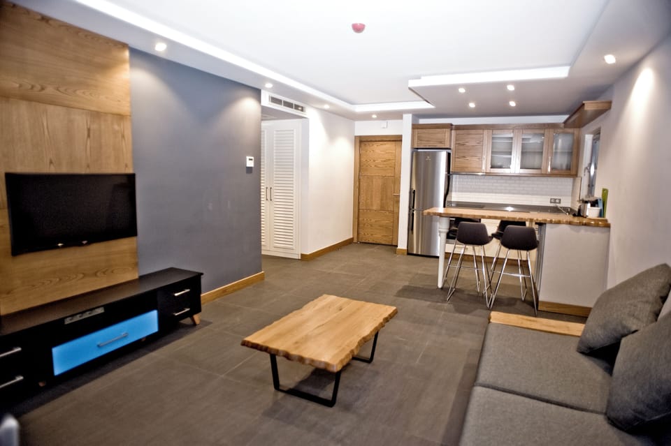 Apartment, 1 Bedroom, Balcony, Sea View | Living area | 39-inch LED TV with satellite channels, TV