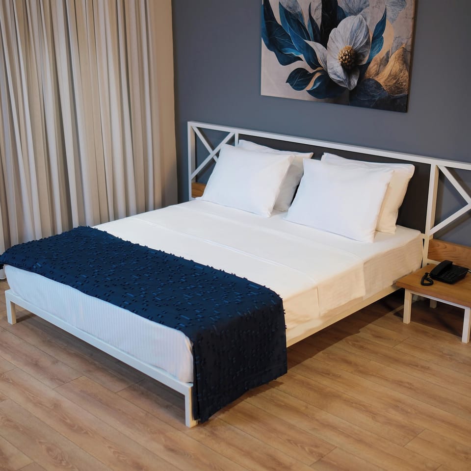 Deluxe Room, River View | In-room safe, desk, laptop workspace, free WiFi