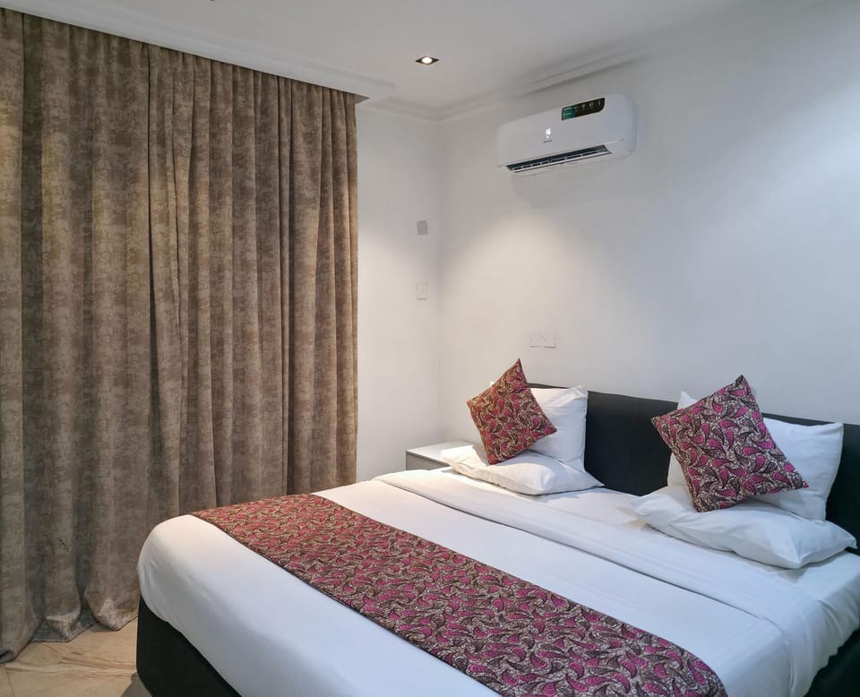 Economy Apartment, Balcony, City View | In-room safe, desk, laptop workspace, blackout drapes