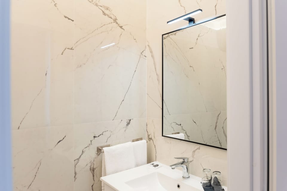 Deluxe Double Room, City View | Bathroom | Shower, hair dryer, towels, soap