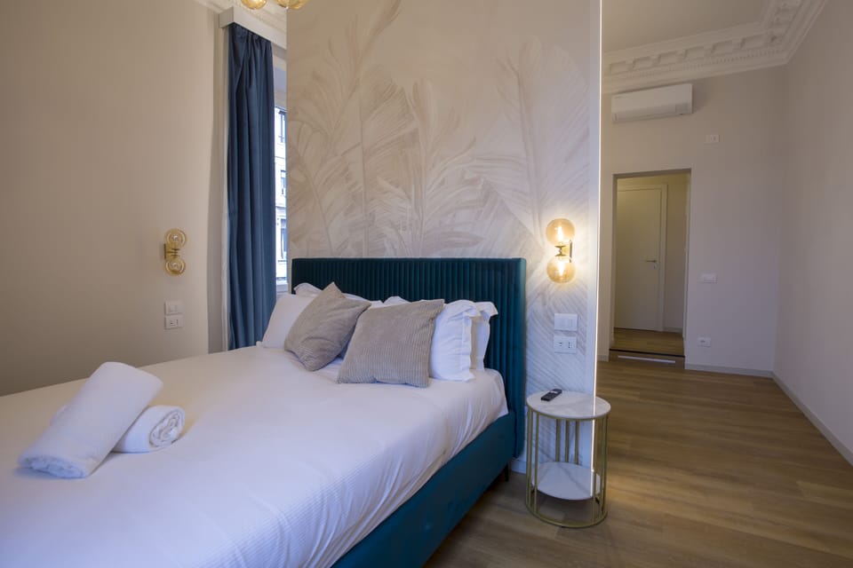 Luxury Quadruple Room, City View | Minibar, in-room safe, desk, blackout drapes