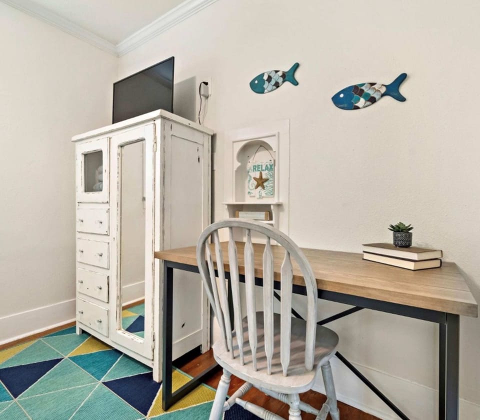 A queen-sized bed & smart TV await in the bedroom retreat​