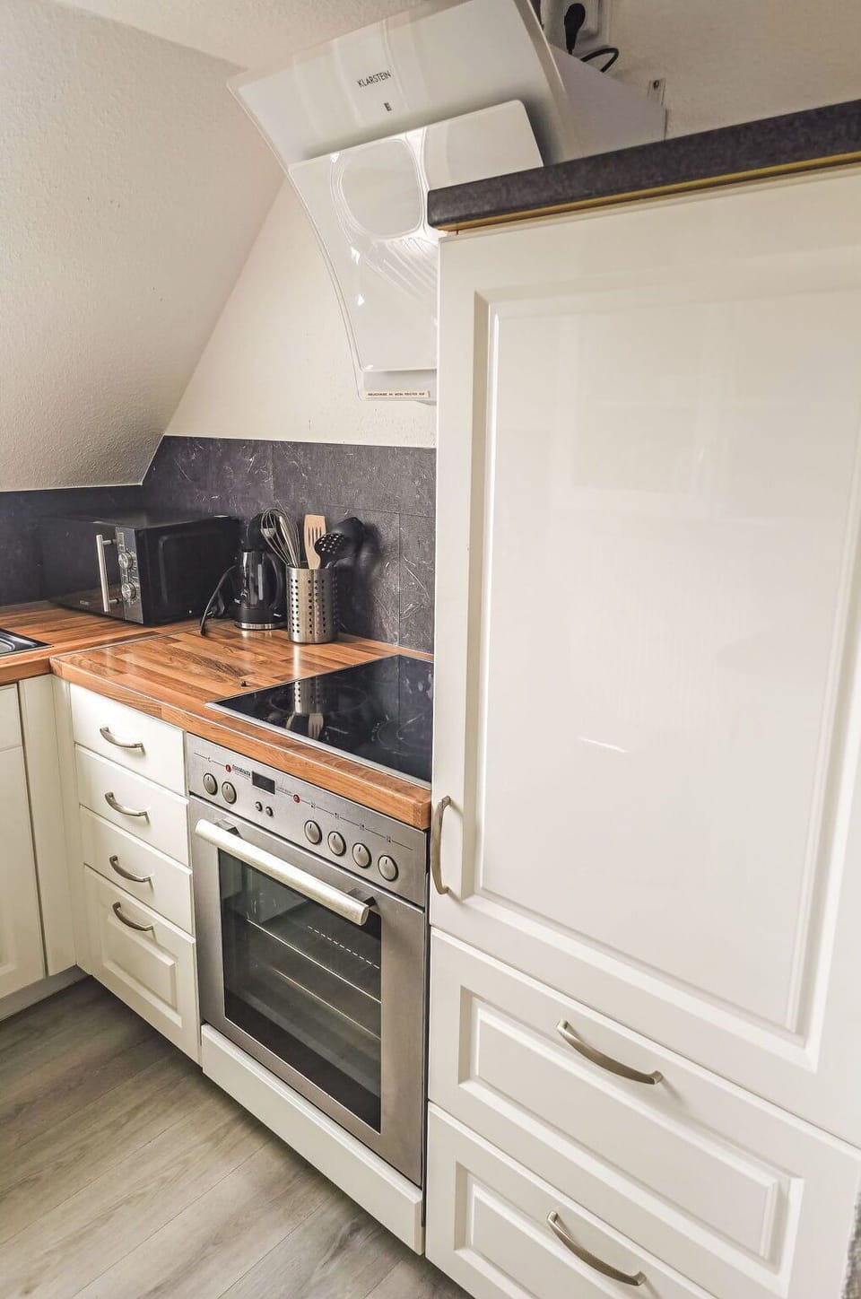 Kitchen, Flooring, Cabinetry, Wood, Countertop, Kitchen Appliance, Interior Design, Major Appliance, Floor, Home