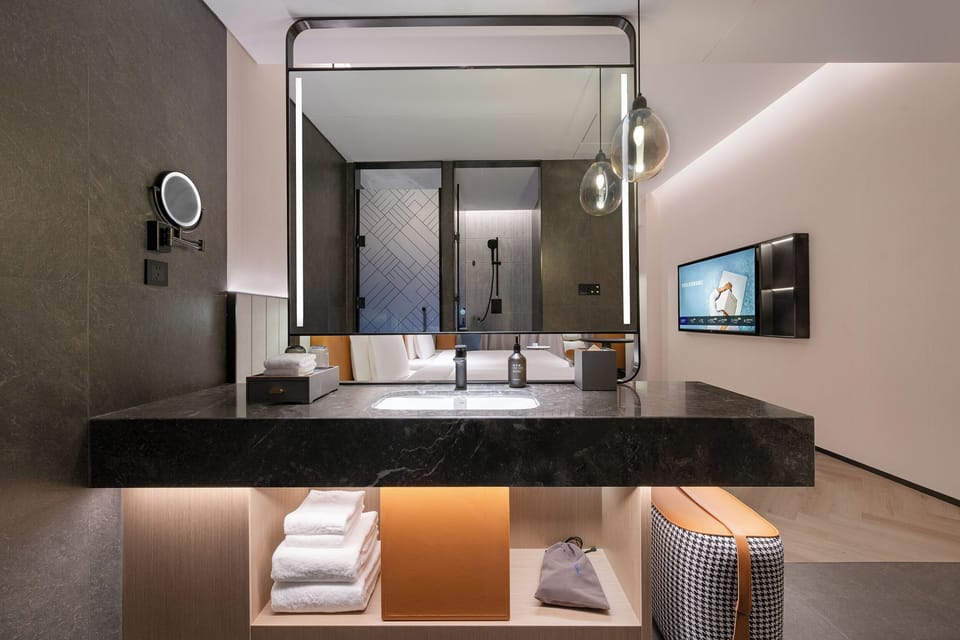 Premium bedding, memory foam beds, free minibar items, desk