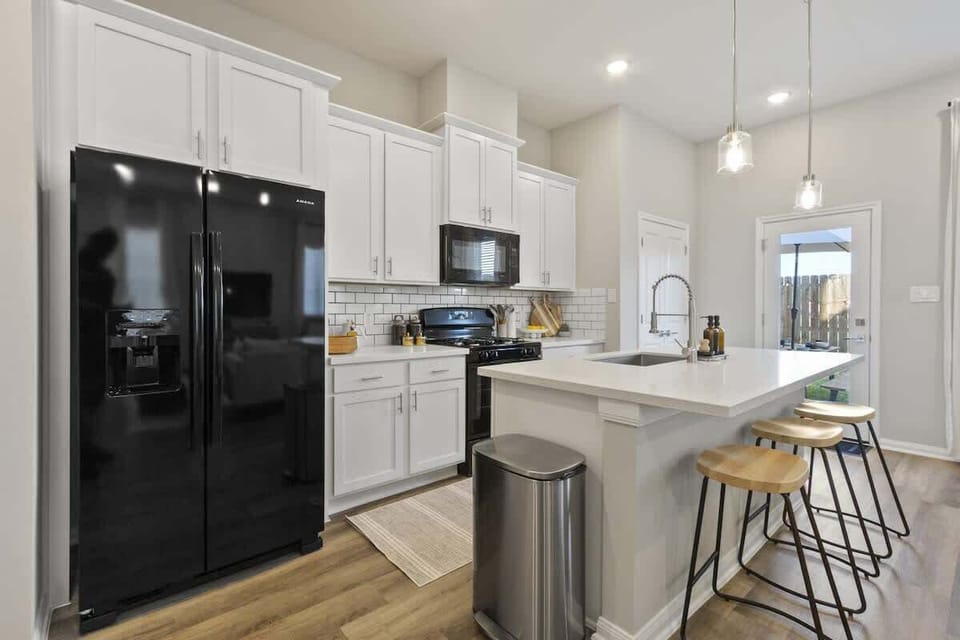 Bright chef’s kitchen with stove, microwave, and everything you need for home-cooked meals.