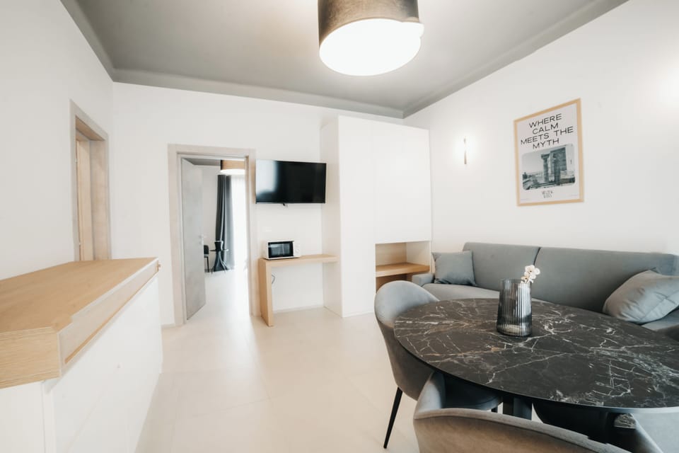 Deluxe Suite, Balcony, City View | Premium bedding, down comforters, minibar, in-room safe
