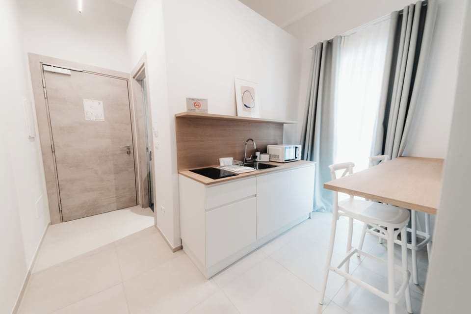 Double or Twin Room | Private kitchenette | Espresso maker, coffee/tea maker, electric kettle, highchair