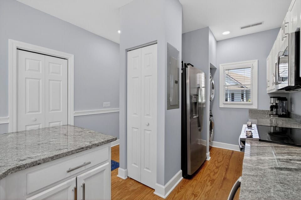 Your modern kitchen features granite countertops, stainless steel appliances, and convenient washer/dryer - perfect for preparing meals and staying fresh.