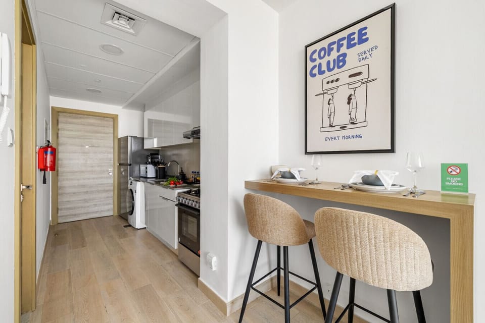 Kitchen and dining area with modern amenities.