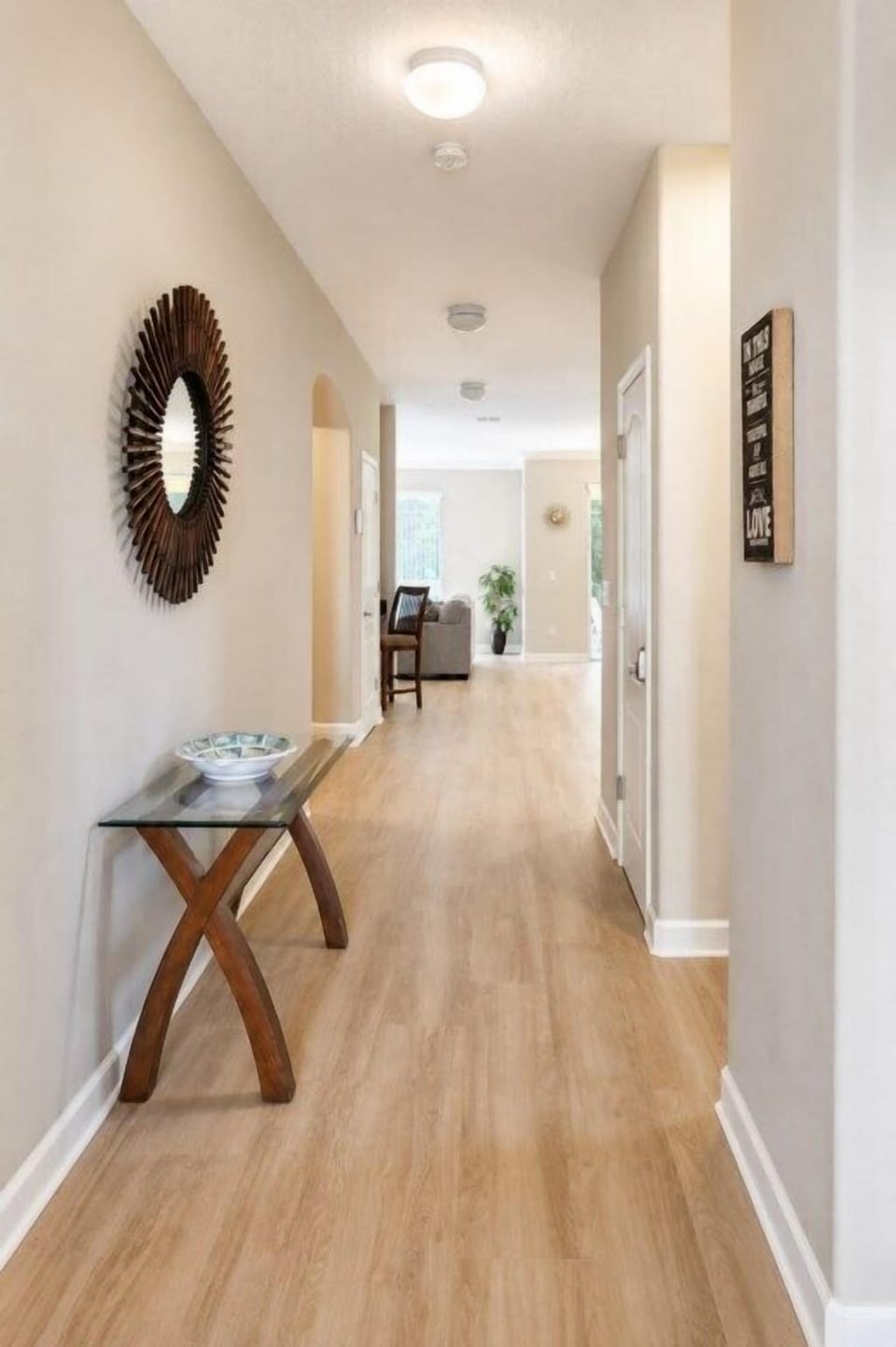 FOYER:  Entryway adjacent to Bedroom 6, Downstairs Hallway Bathroom and Stairwell to 2nd Floor