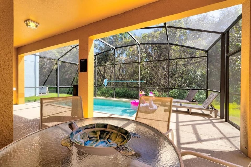 COVERED PATIO:  Overhang with Outdoor Patio Furniture including Table with Seating for 4 plus 2 Chaise Lounges