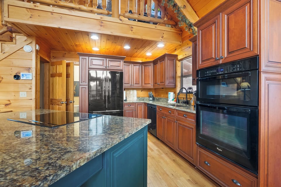 Fully equipped kitchen with plenty of space for cooking and gathering.