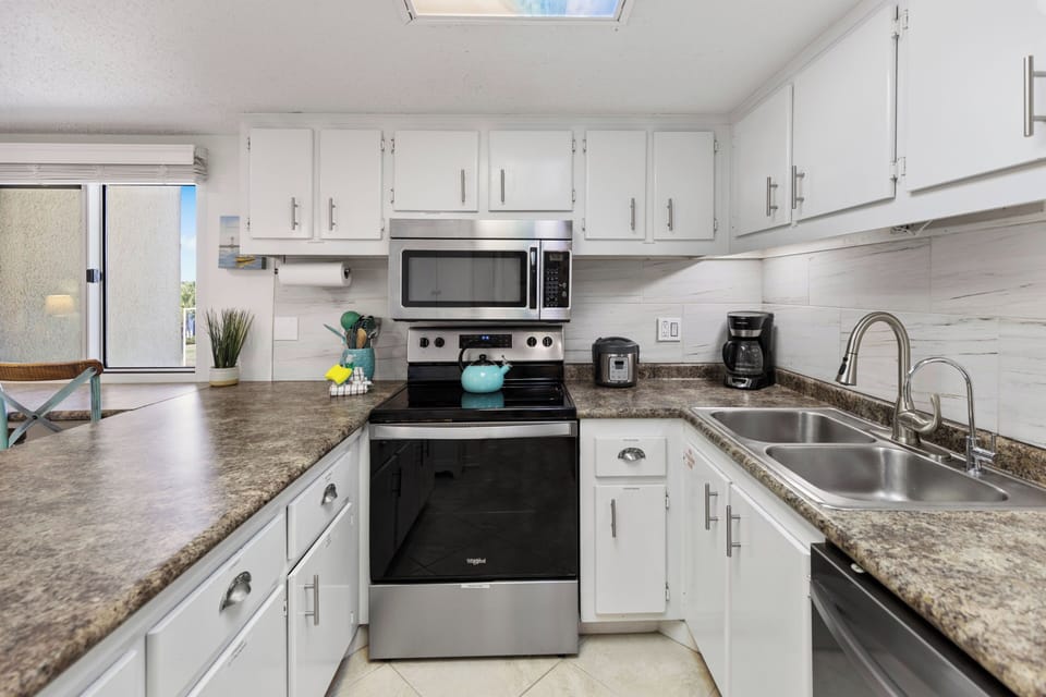 Your fully equipped kitchen awaits with granite counters, stainless appliances, and everything you need to create delicious meals during your stay.