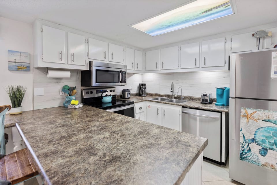 Your fully equipped kitchen features granite counters, stainless appliances, and everything you need to create memorable meals during your stay.