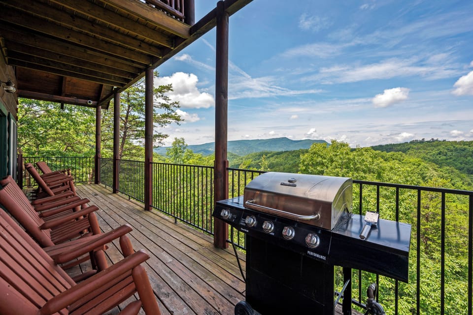 Lazy Bear's Grill and relax in style with a view of the mountains on the main floor deck, with easy access to the kitchen dining and living rooms.