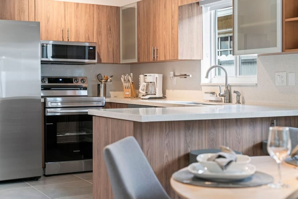 Kitchen: The ultimate gathering spot for homework or hors d`oeuvres.
