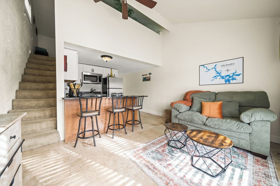 Spacious open-concept living area with high ceilings.