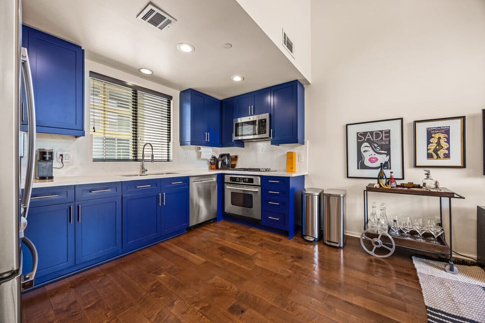 Fully equipped kitchen with stainless steel appliances.