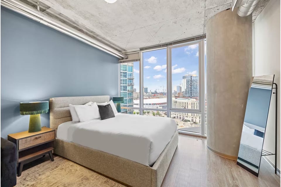Wake up to sweeping city views from plush linens.