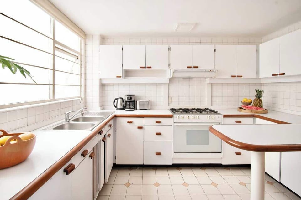 Everything you need within reach, from microwave and toaster to cookware, making every meal effortless.