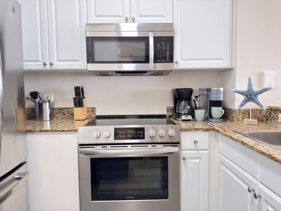 Fully equipped kitchen with 12-cup coffee maker and Keurig.