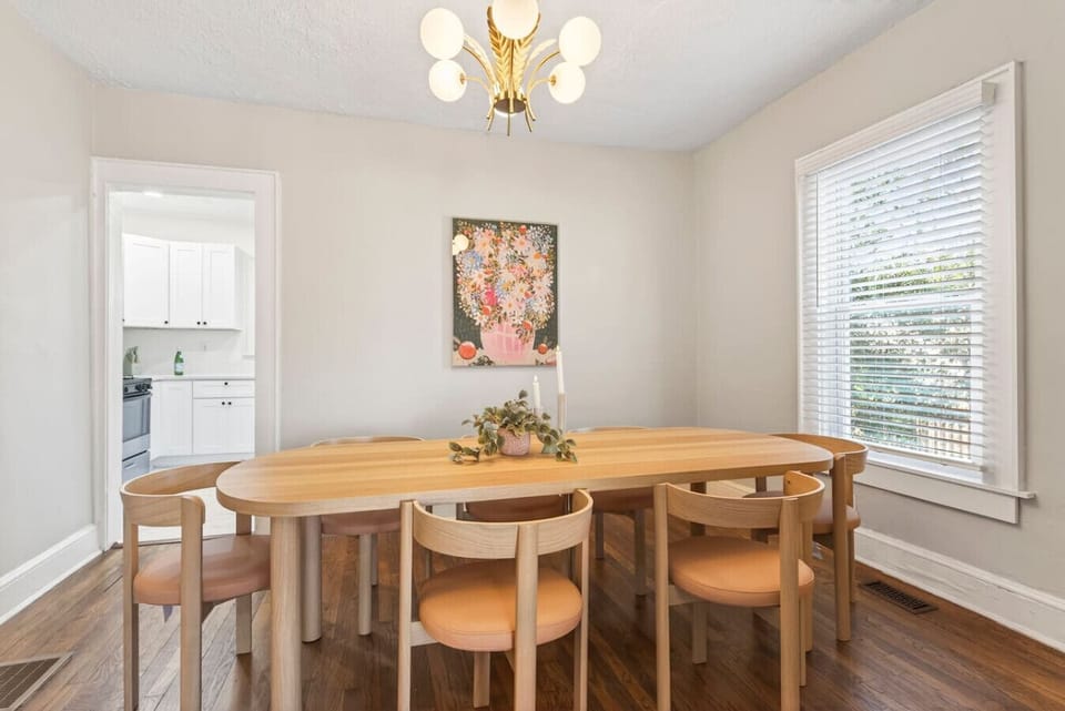 Modern dining room table for romantic candlelit dinners, a productive workspace, or a fun board game zone