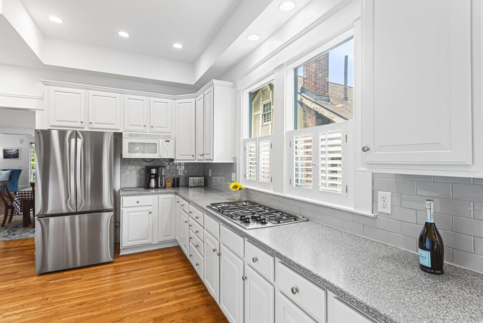 Refigerator with french doors and long countertops with countertop stove