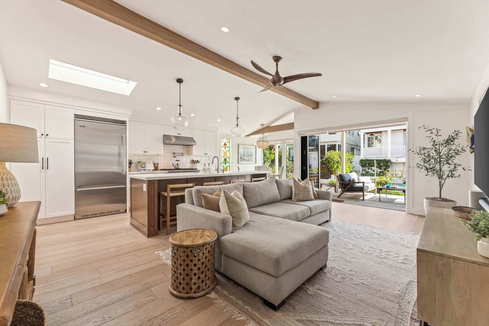 This open living space brings together natural light, clean design, and an easy indoor-outdoor flow for a relaxed stay.
