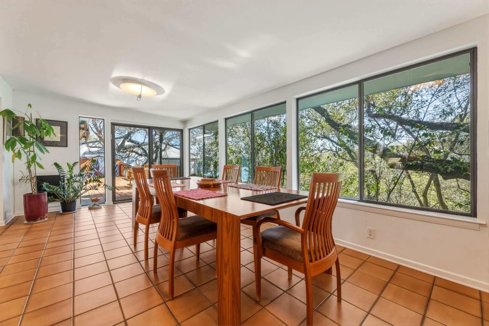 Open dining room with seating for 6 and deck access