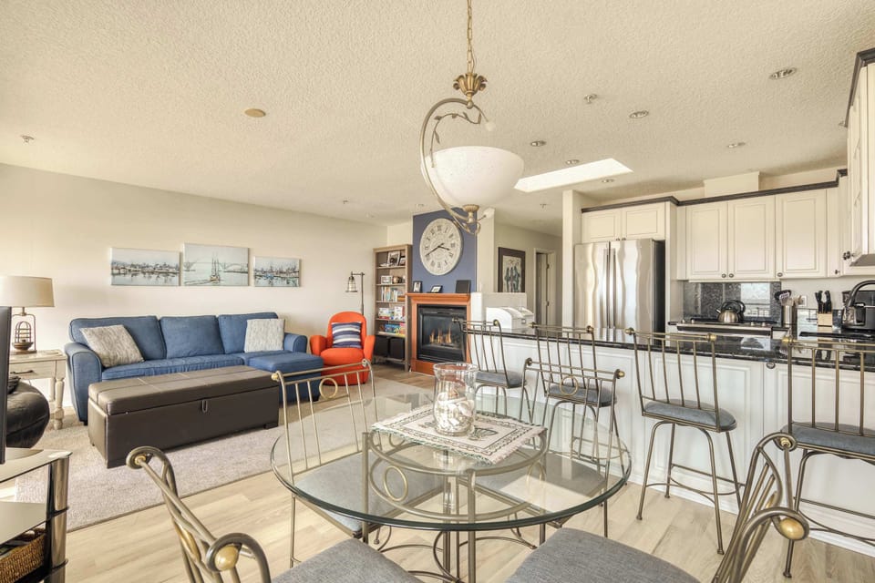 Gather for meals, relax on the sofa, and enjoy time together in this bright, open space designed for connection and comfort.