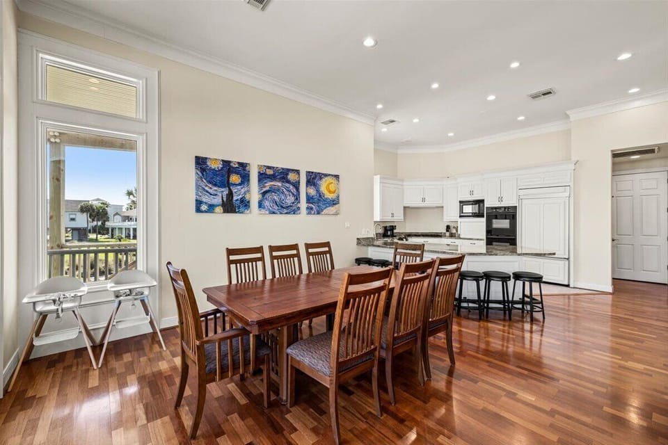 Dining area with seating for large groups in beachfront Galveston home
