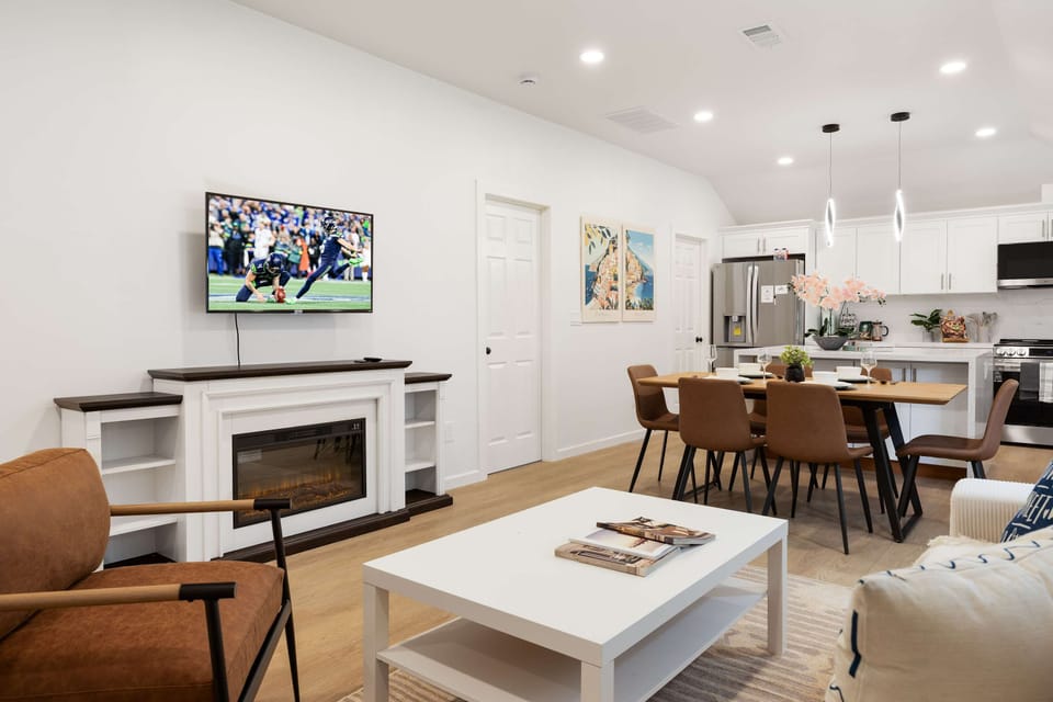 Relaxing living room with a fireplace and TV—ideal for cozy nights in.