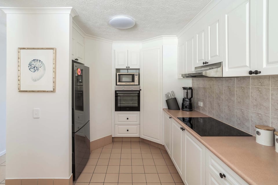 Fully equipped kitchen with CHEF electric wall oven and OMEGA 70cm ceramic cooktop