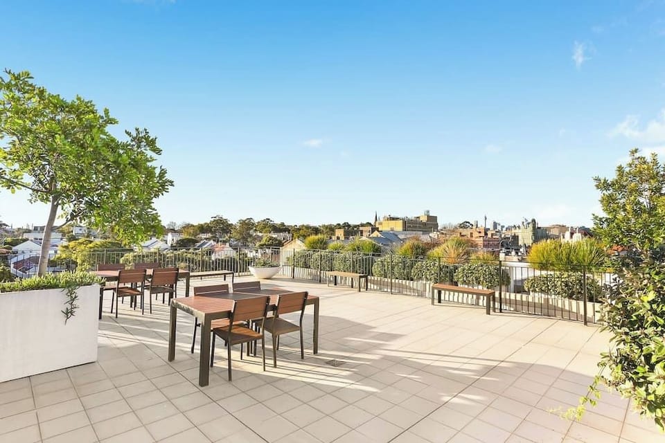 Lovely open rooftop space with seating, perfect for area views and Sydney's sunsets