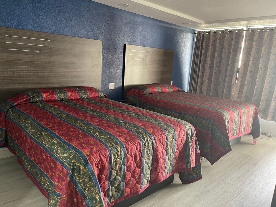 Standard Room, 2 Double Beds | Desk, iron/ironing board, free WiFi, bed sheets