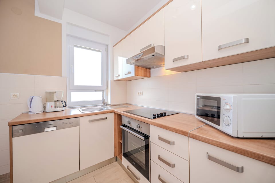 Classic Apartment, Partial Sea View | Private kitchen | Full-size fridge, microwave, oven, stovetop