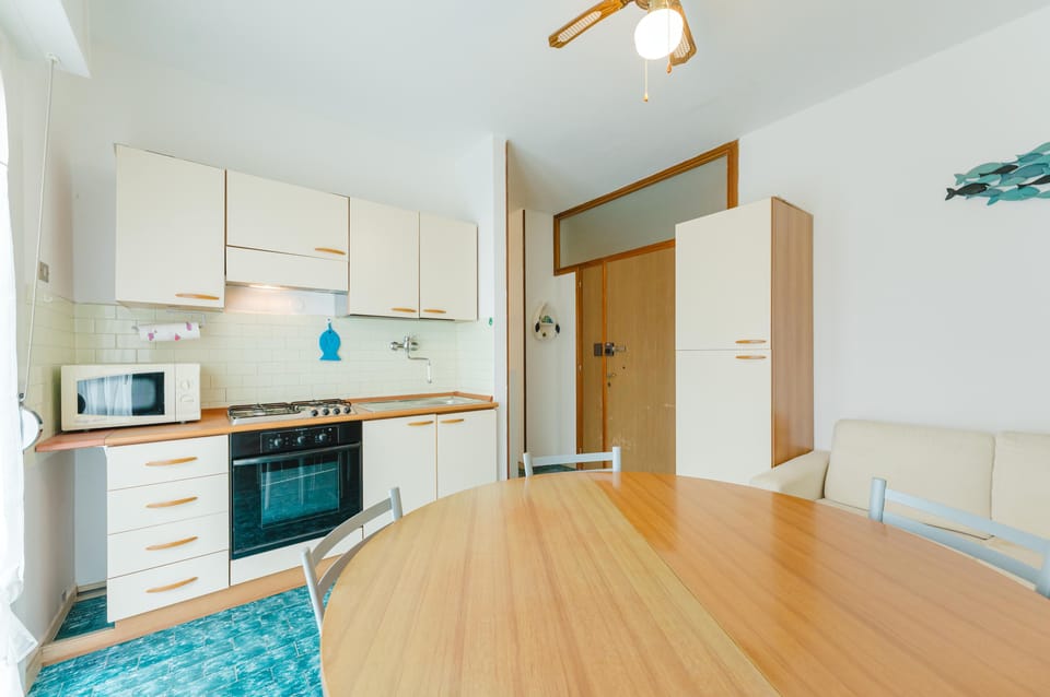 Apartment, Balcony, Beach View | Private kitchen | Espresso maker, fridge, microwave, oven