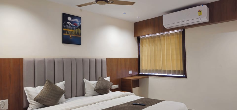 Deluxe Double Room, City View | In-room safe, desk, laptop workspace, iron/ironing board