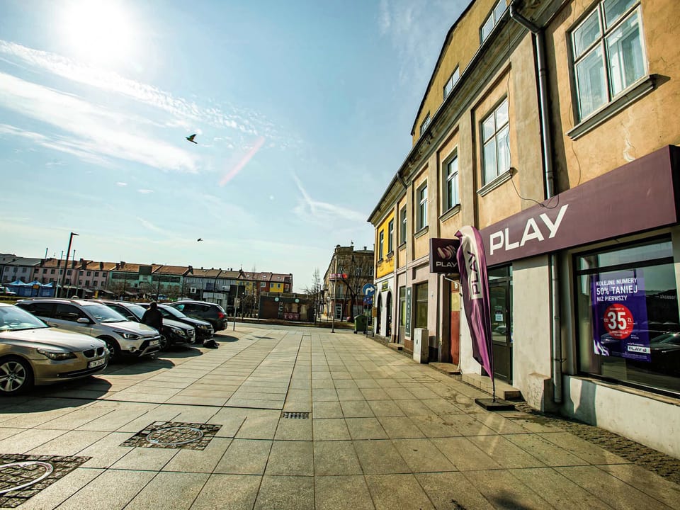 . The wide walkway and outdoor seating areas create a pleasant atmosphere for walking and exploring.