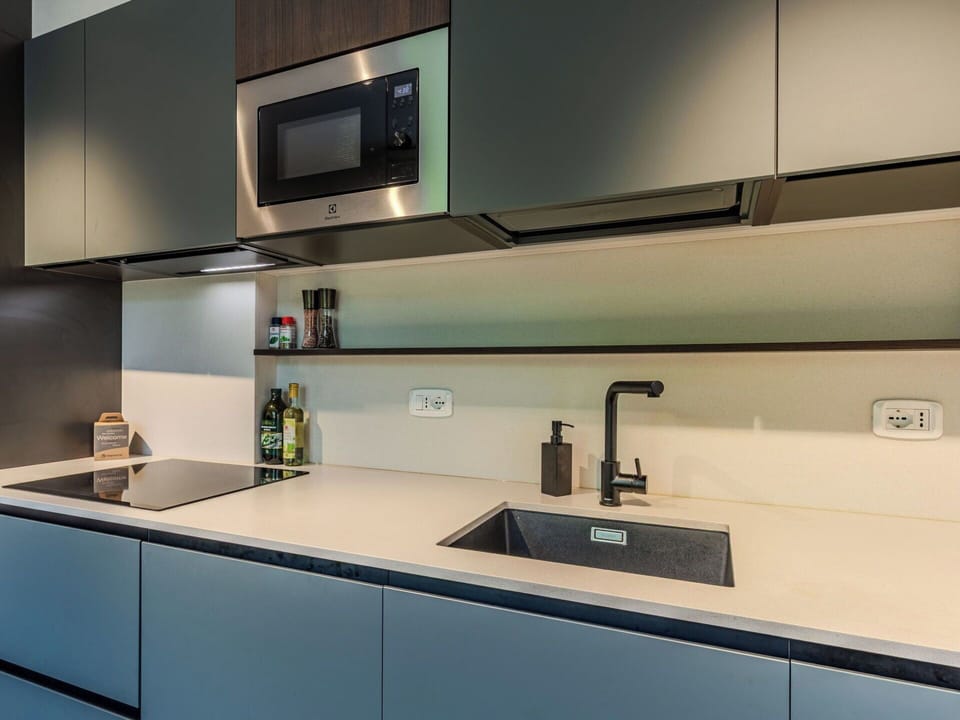 Kitchen, Countertop, Cabinetry, Kitchen Appliance, Interior Design, Sink, Major Appliance, Plumbing Fixture, Kitchen Sink, Kitchen Stove