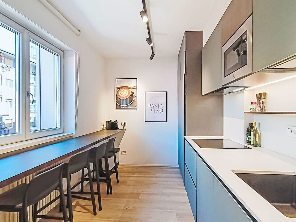 Interior Design, Flooring, Furniture, Kitchen, Countertop, Ceiling, Floor, Light Fixture, Lighting, Room