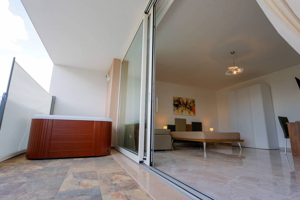 Junior Suite, Pool View | Minibar, in-room safe, desk, rollaway beds